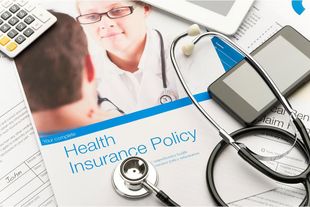 Health Insurance Policy With A Stethoscope — Upland, CA — Embrace Health Insurance Agency