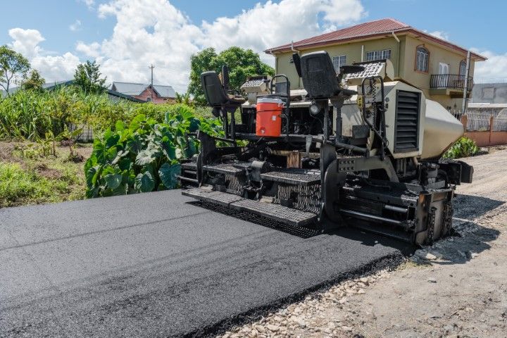 Asphalt machine paving a road