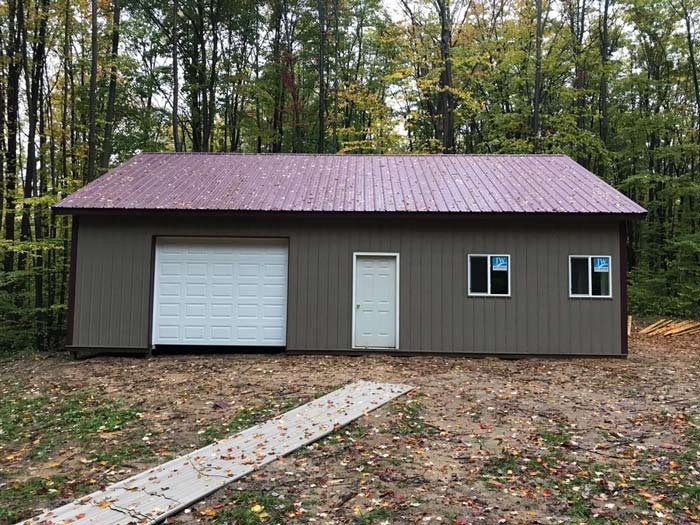 grey barn in the woods