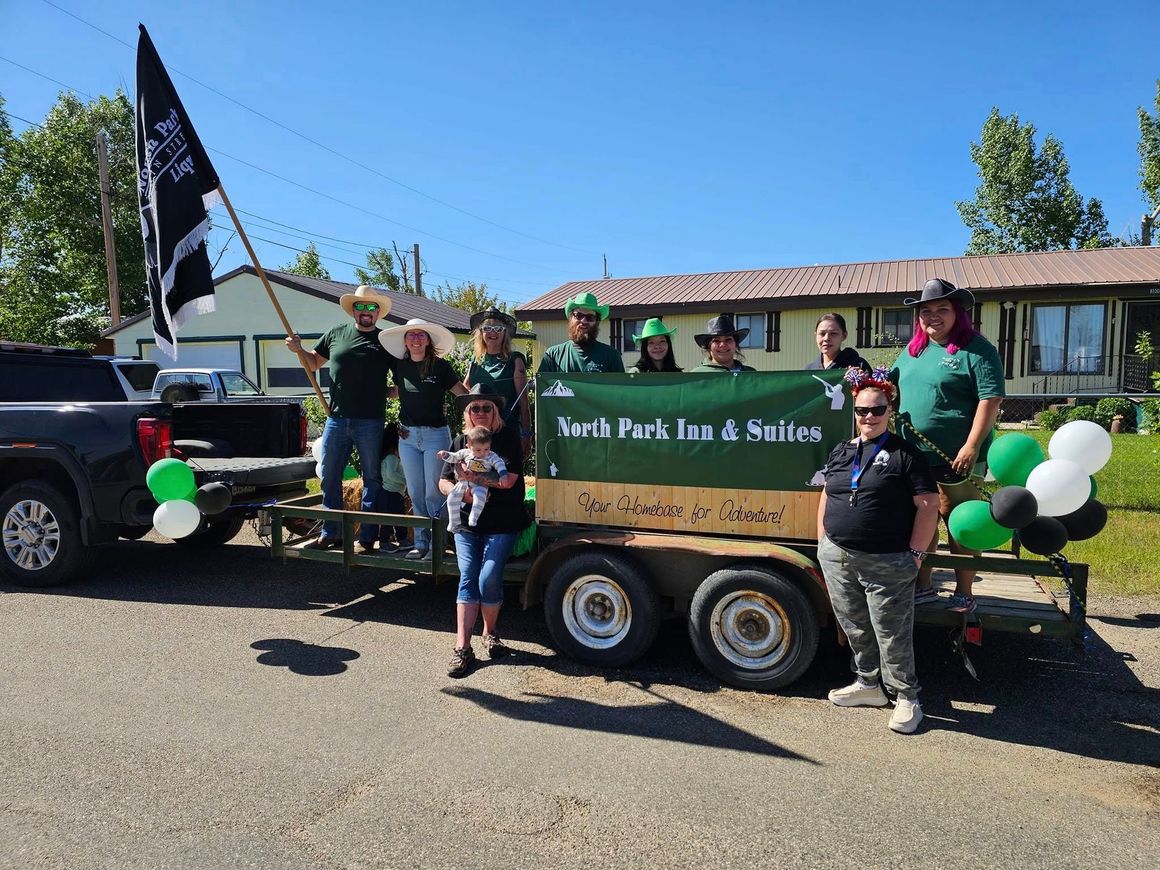 A group of people are standing in front of a trailer.