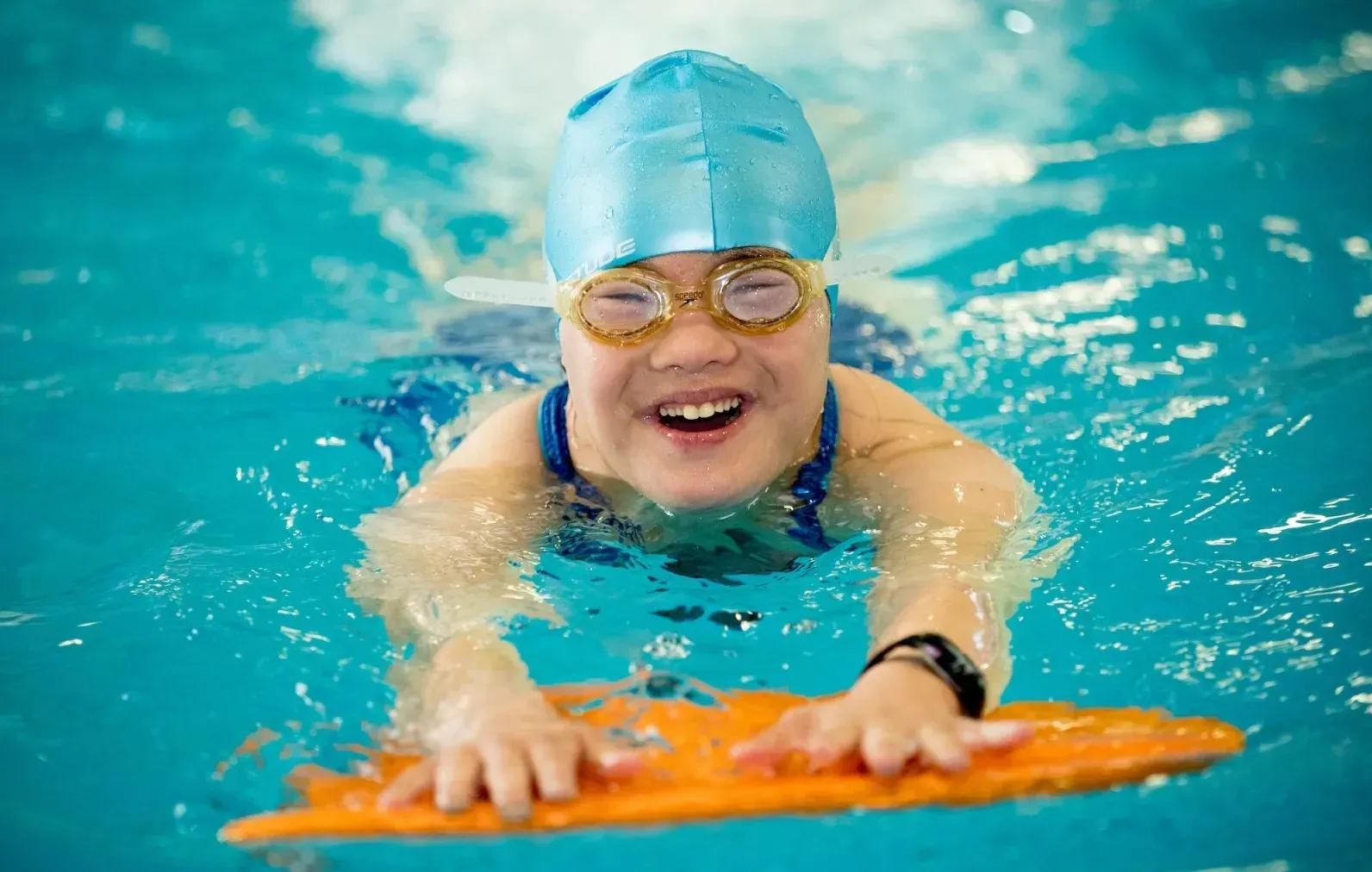Child participating in special needs swim instruction