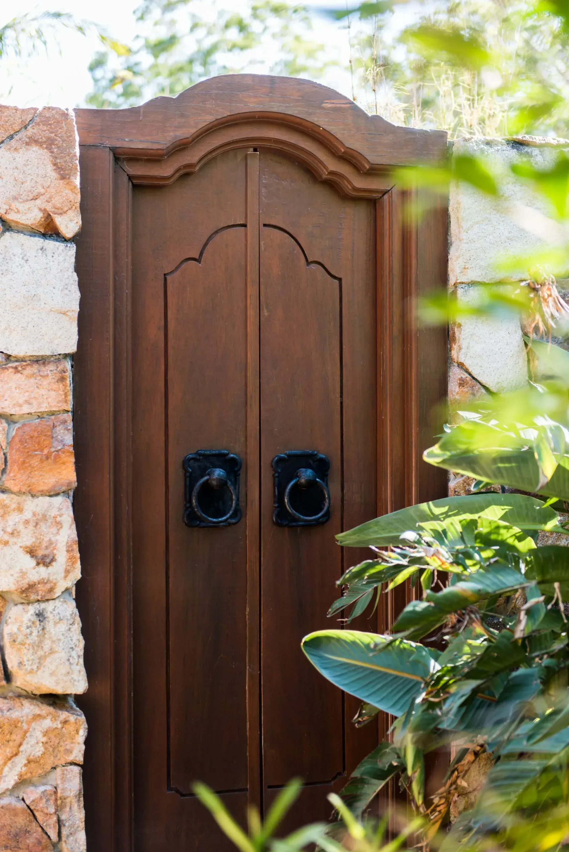 A Bedroom With a Large Bed and a Ceiling Fan — Bali at the Bay in Nelson Bay, NSW