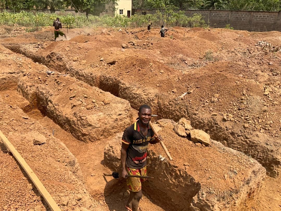 Volunteers hard at work digging foundation