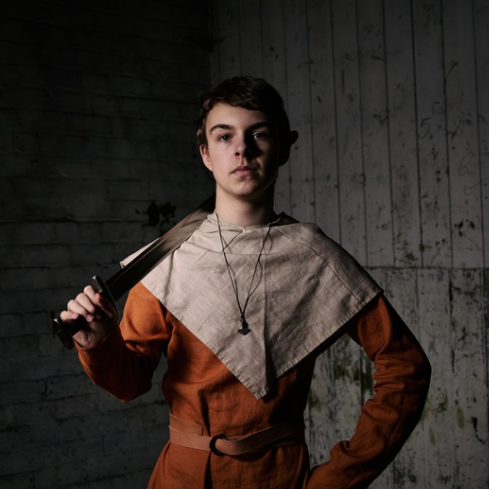 A young man dressed as a viking.