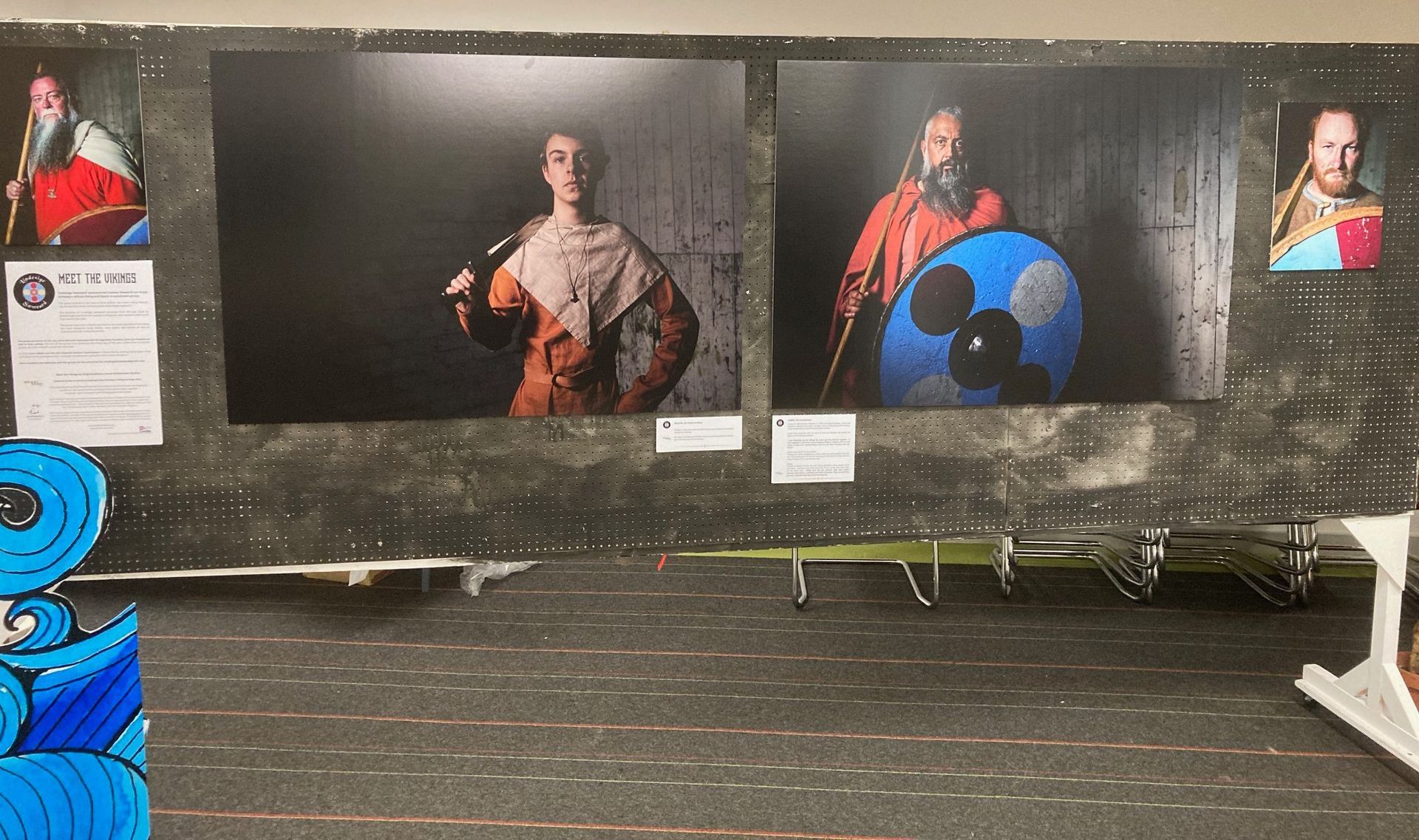 A wall with a bunch of pictures on it