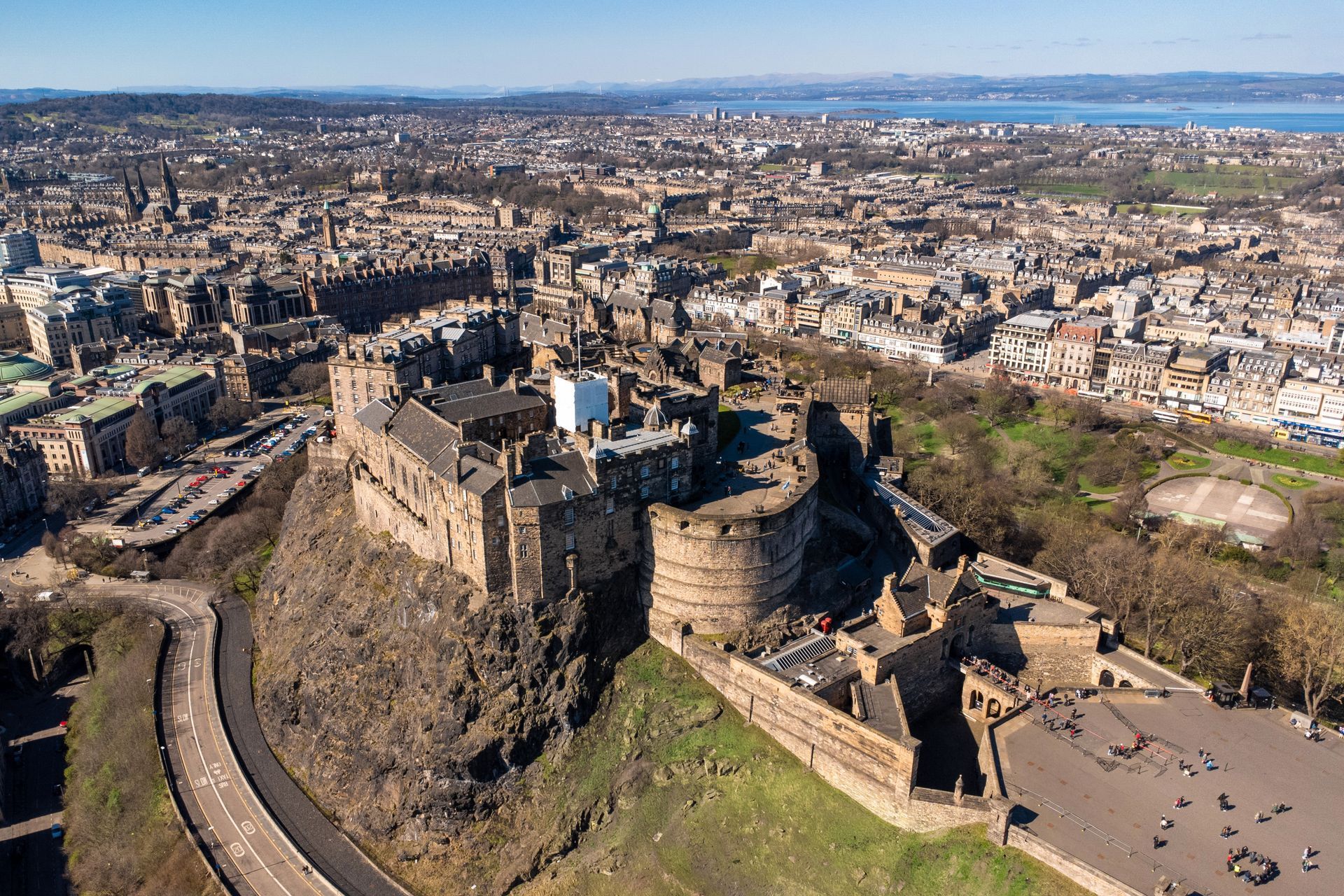 An aerial view of a city with a lot of buildings and trees. Book a One Bed Apartment at Grassmarket at BonnieHotel.com, Edinburgh; click here and book family apartments directly for the best accommodation deals in Central Edinburgh.