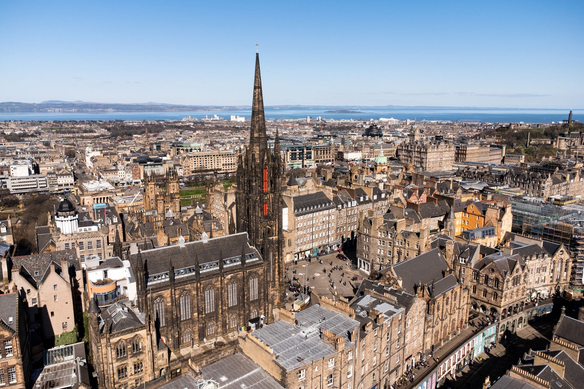 An aerial view of a city with a lot of buildings and trees. Book a One Bed Apartment at Grassmarket at BonnieHotel.com, Edinburgh; click here and book family apartments directly for the best accommodation deals in Central Edinburgh.