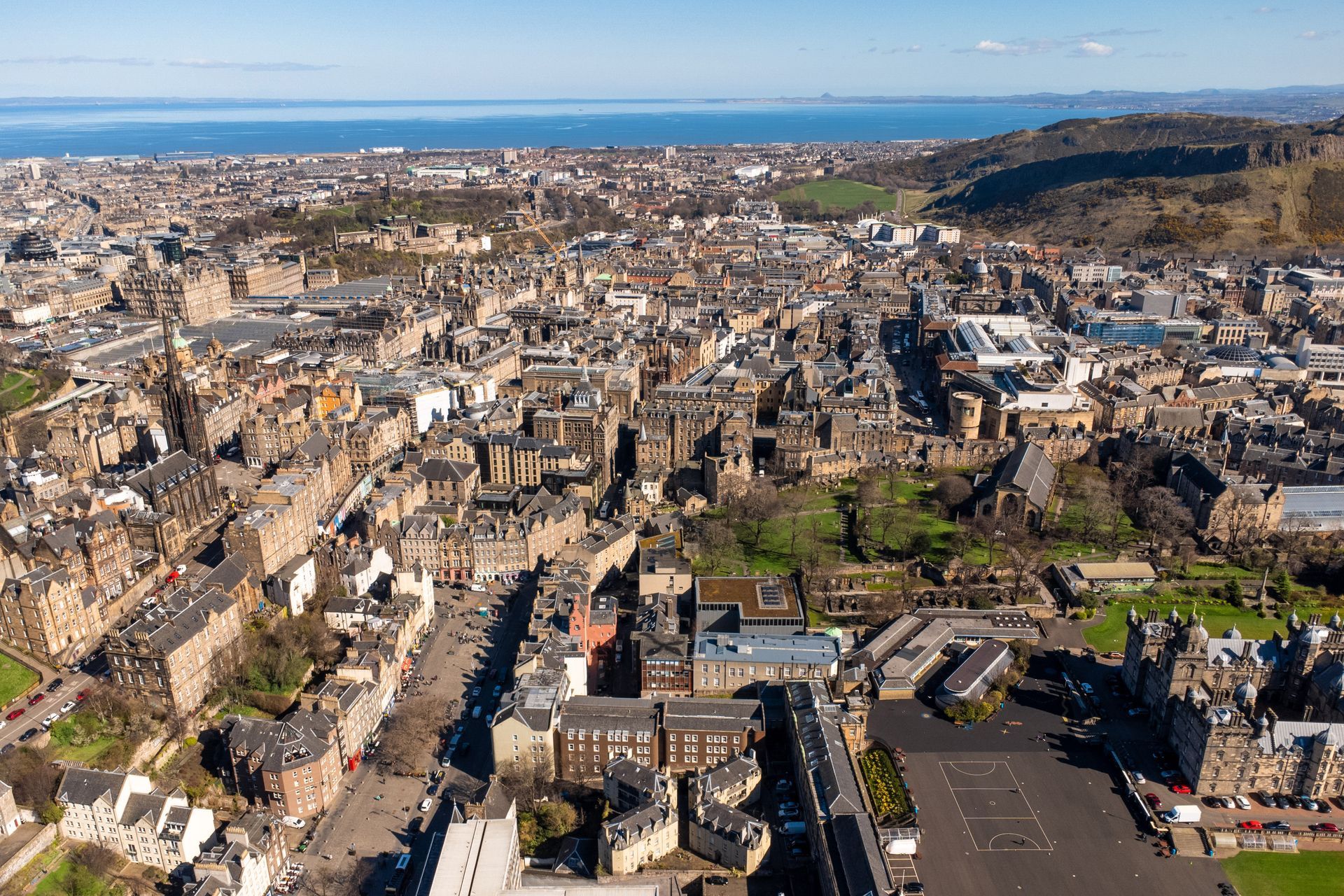 An aerial view of a city with a lot of buildings and trees. Book a One Bed Apartment at Grassmarket at BonnieHotel.com, Edinburgh; click here and book family apartments directly for the best accommodation deals in Central Edinburgh.