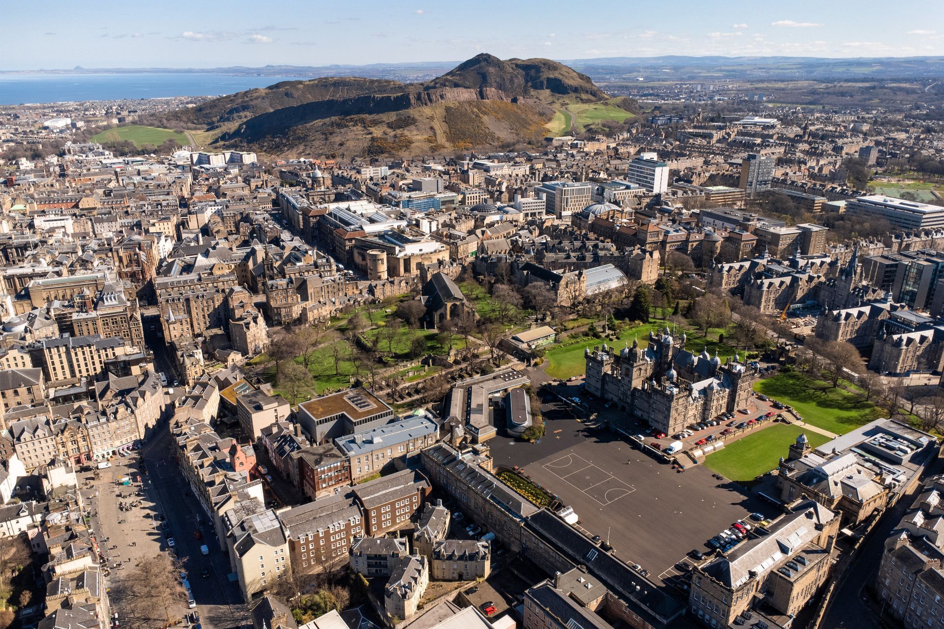 An aerial view of a city with a lot of buildings and trees. Book a One Bed Apartment at Grassmarket at BonnieHotel.com, Edinburgh; click here and book family apartments directly for the best accommodation deals in Central Edinburgh.