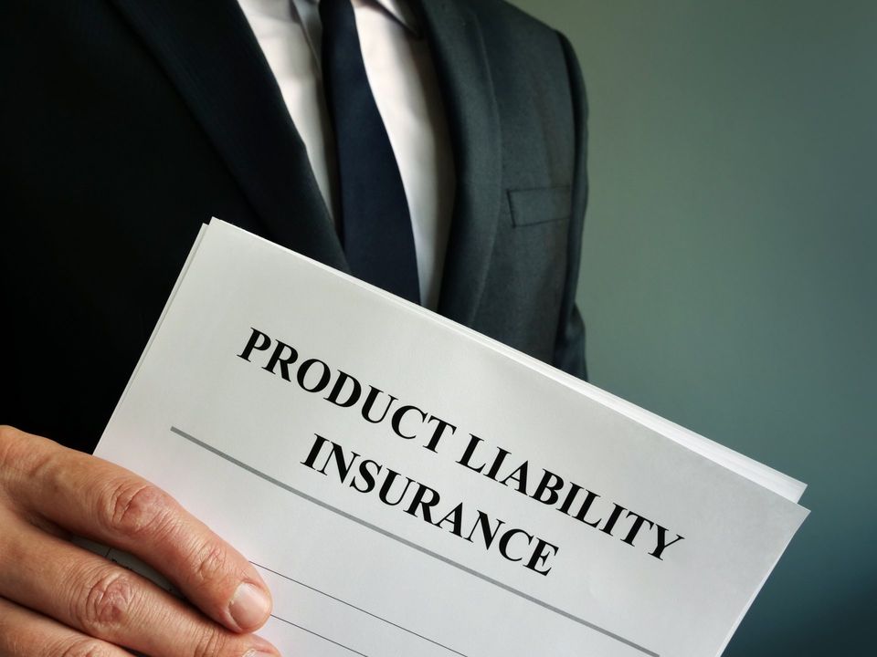 Manager holding product liability paperwork