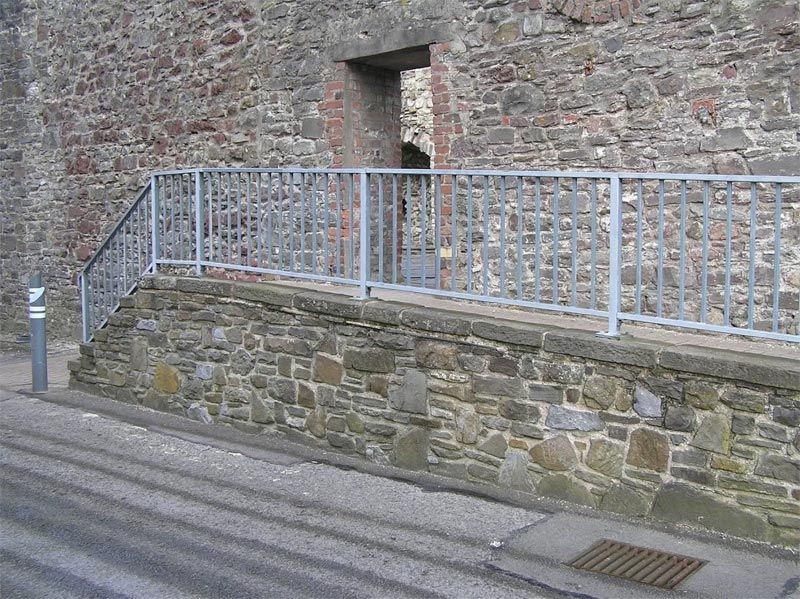 Steel balcony on raised footpath