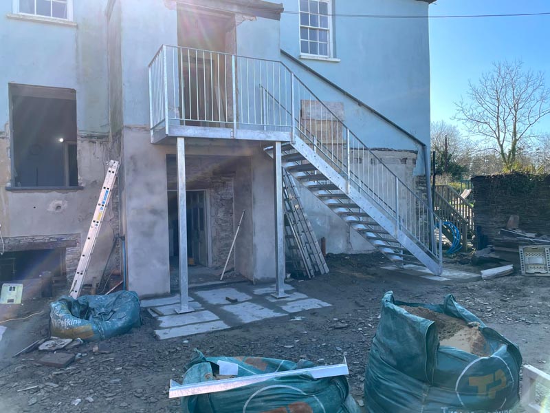 steel access staircase up to second floor of property