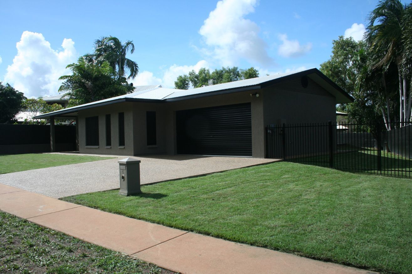 A house with a fence and a lush green lawn — Local Builders in Yarrawonga, NT