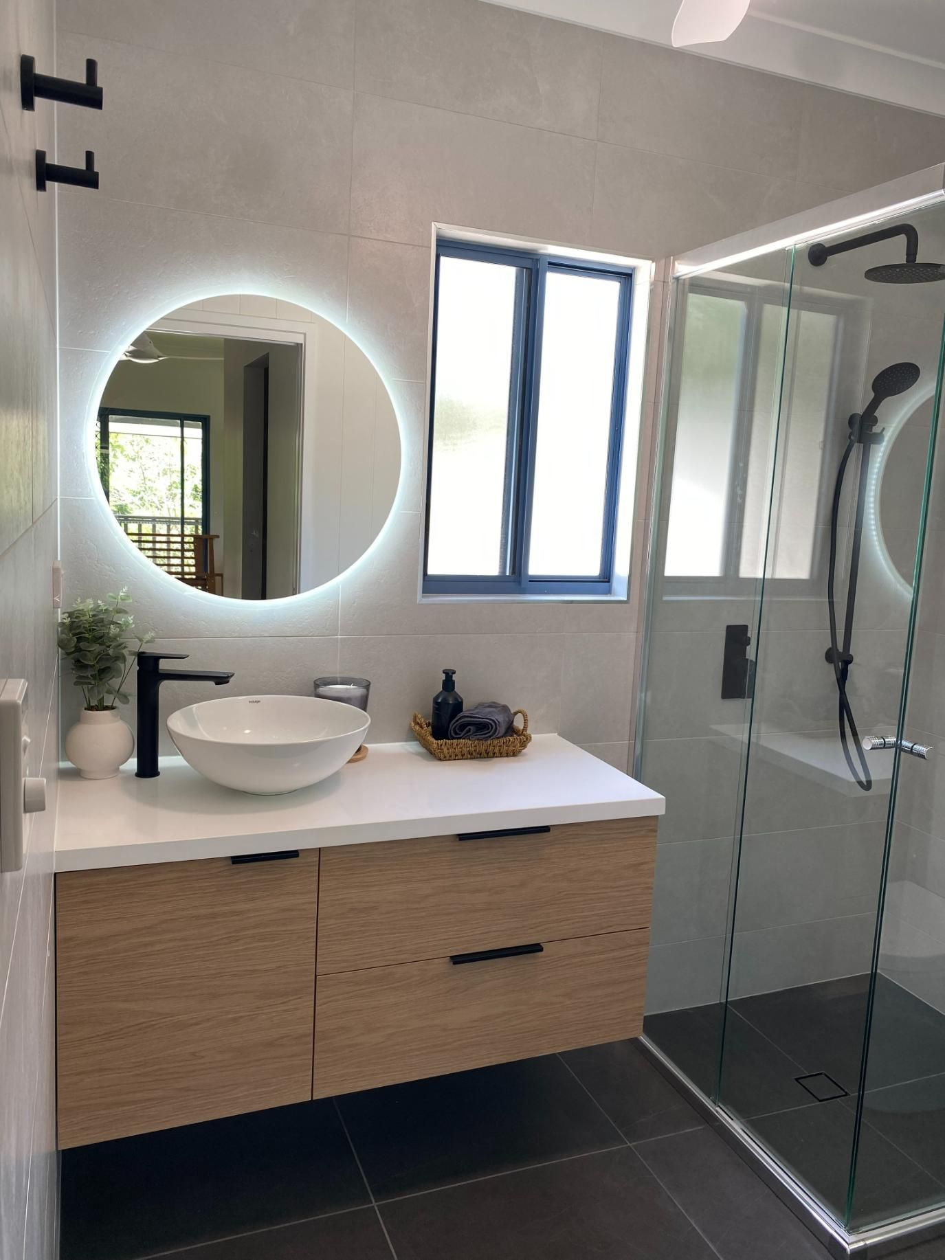 A Bathroom With a Sink, Mirror and Shower — Custom Bathroom Renovations in Yarrawonga, NT
