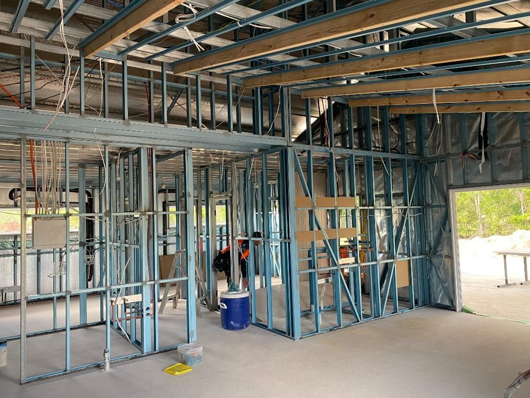 The Inside of a Building Under Construction With a Lot of Metal Frames — Commercial Shop Fitout in Yarrawonga, NT