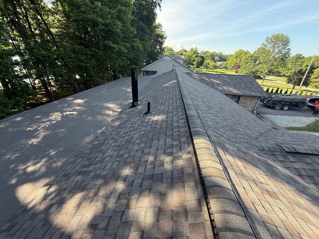 The roof of a house with a lot of shingles on it.