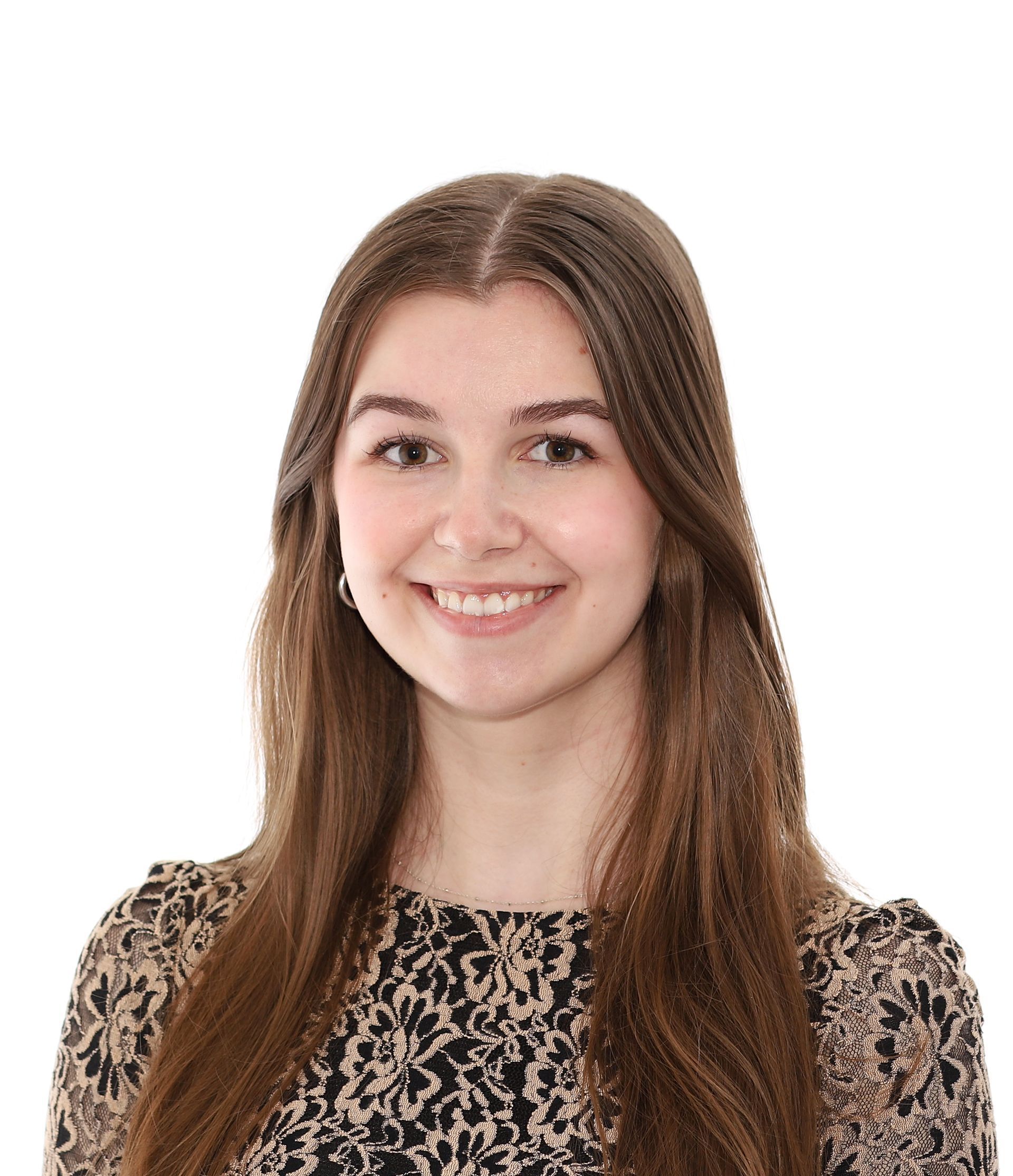 A young woman with long brown hair is smiling for the camera.