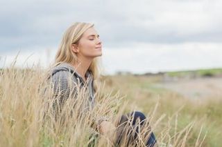 Woman Sitting at the Beach - Anxiety Counselor in Crown Point and Munster, IN