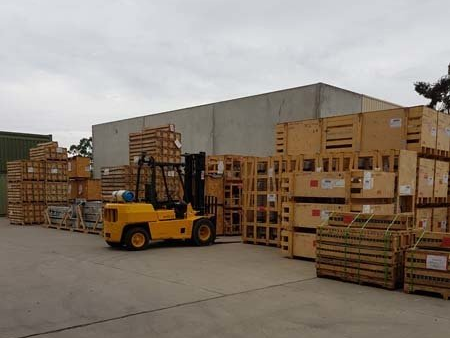 warehouse with equipment and vehicles