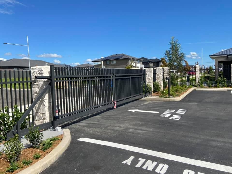 Sliding Gate with Road Mark Signs — Penrith, NSW — C&C Wrought Iron