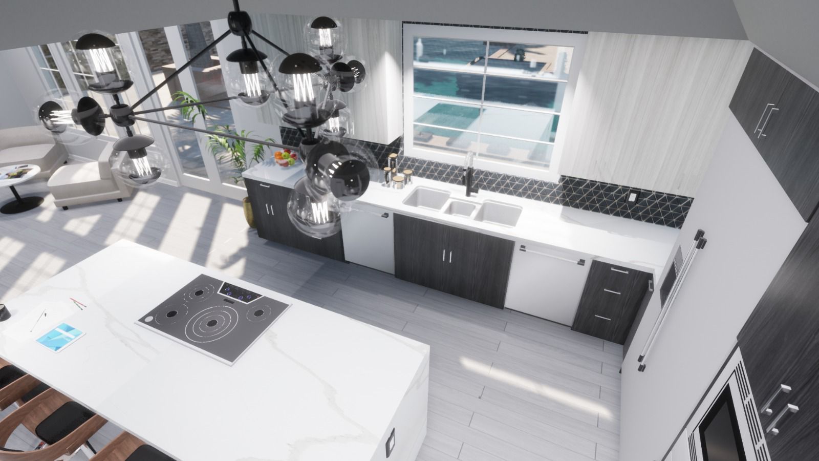 An aerial view of a kitchen with black and white cabinets and a large island.