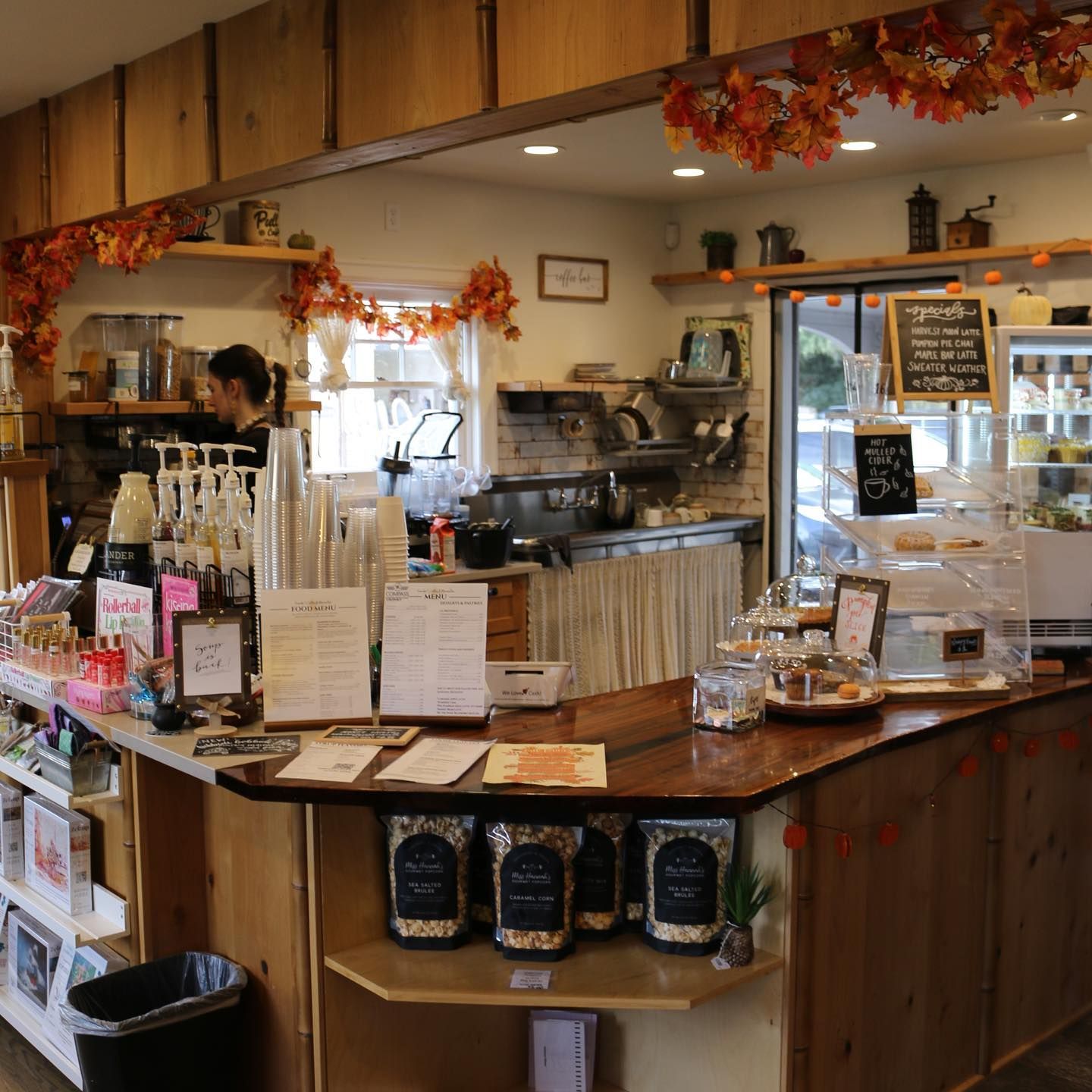 The inside of a restaurant with a chalkboard that says ' coffee ' on it