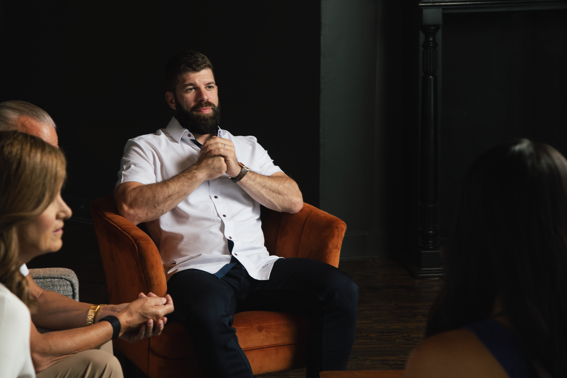 Two men in suits and ties are standing next to each other in a room.