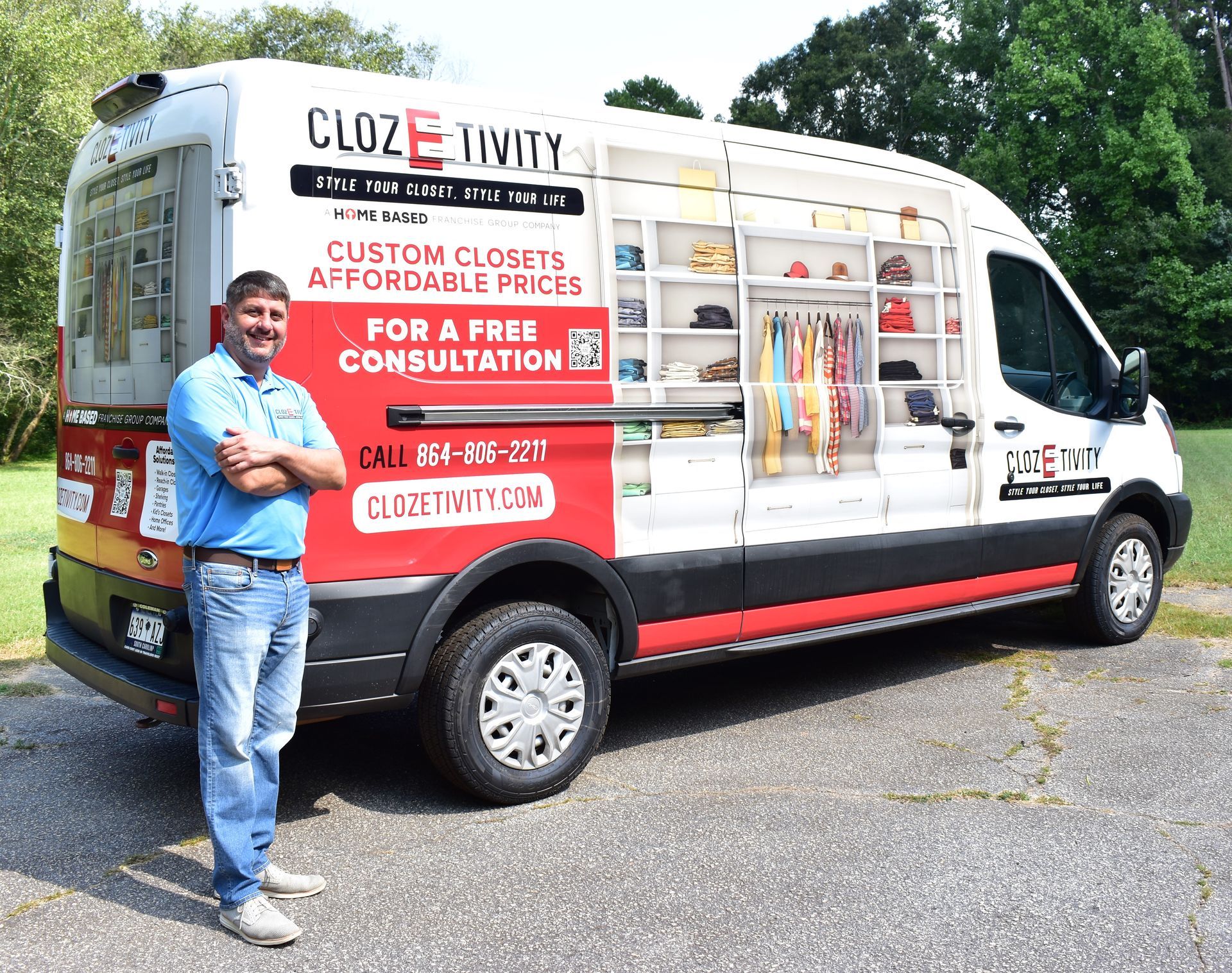 Man stands beside a van with 