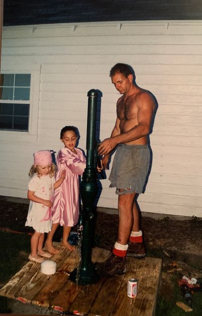 Man And Two Girls Using Water Pump — Northeast, IN — Amstutz Well Drilling
