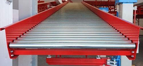 A conveyor belt is being used in a warehouse.