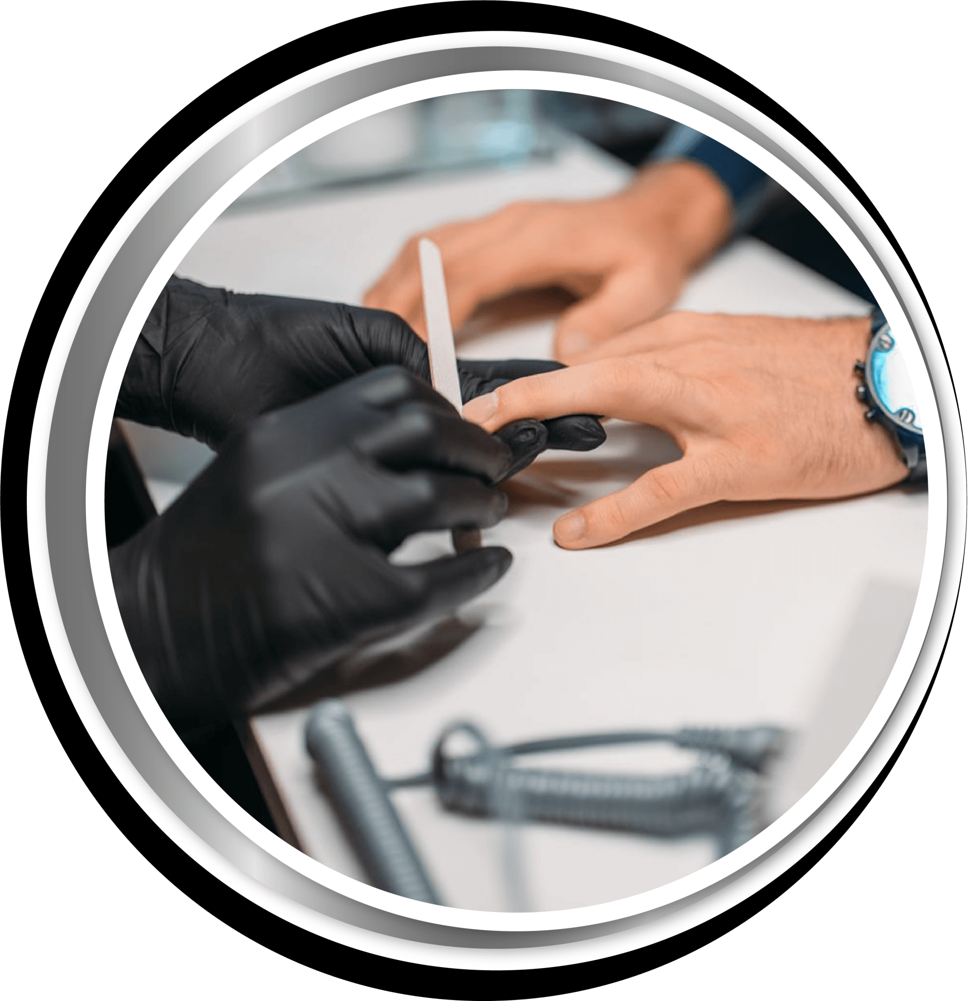 A man is getting his nails done by a woman wearing black gloves.