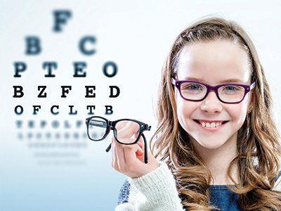 Girl Holding Glasses - Eye Exams in Methuen, MA