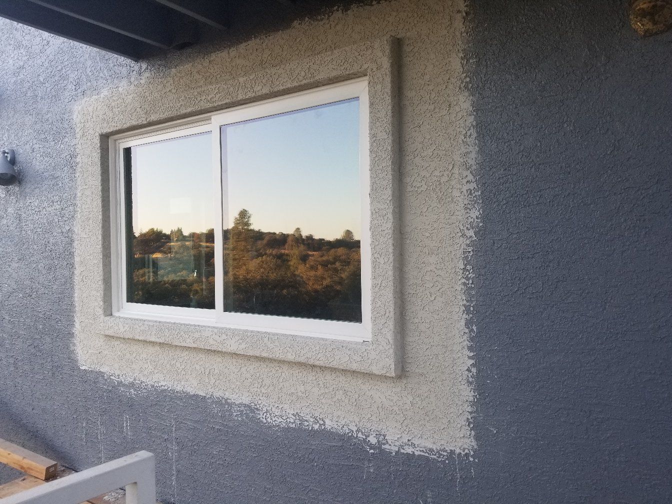 A large window is on the side of a building.