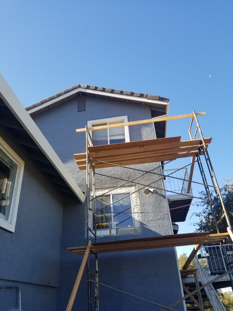 A house with a scaffolding on the side of it