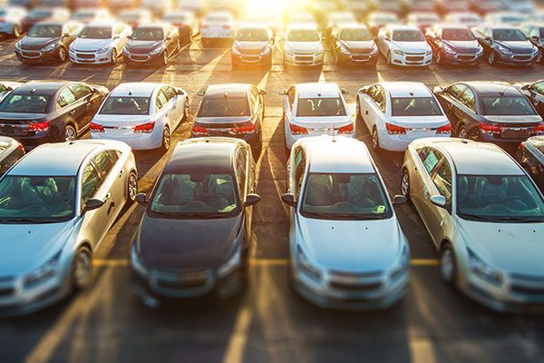 A lot of cars are parked in a parking lot.