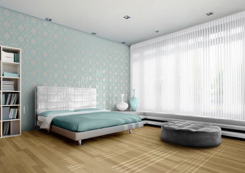 A Bedroom With a Bed, Ottoman, Bookshelf and Large Windows — Whitsunday Vogue Interiors in Airlie Beach, QLD