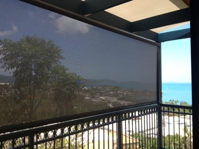A Balcony With a View of the Ocean and Trees — Whitsunday Vogue Interiors in Cannonvale, QLD