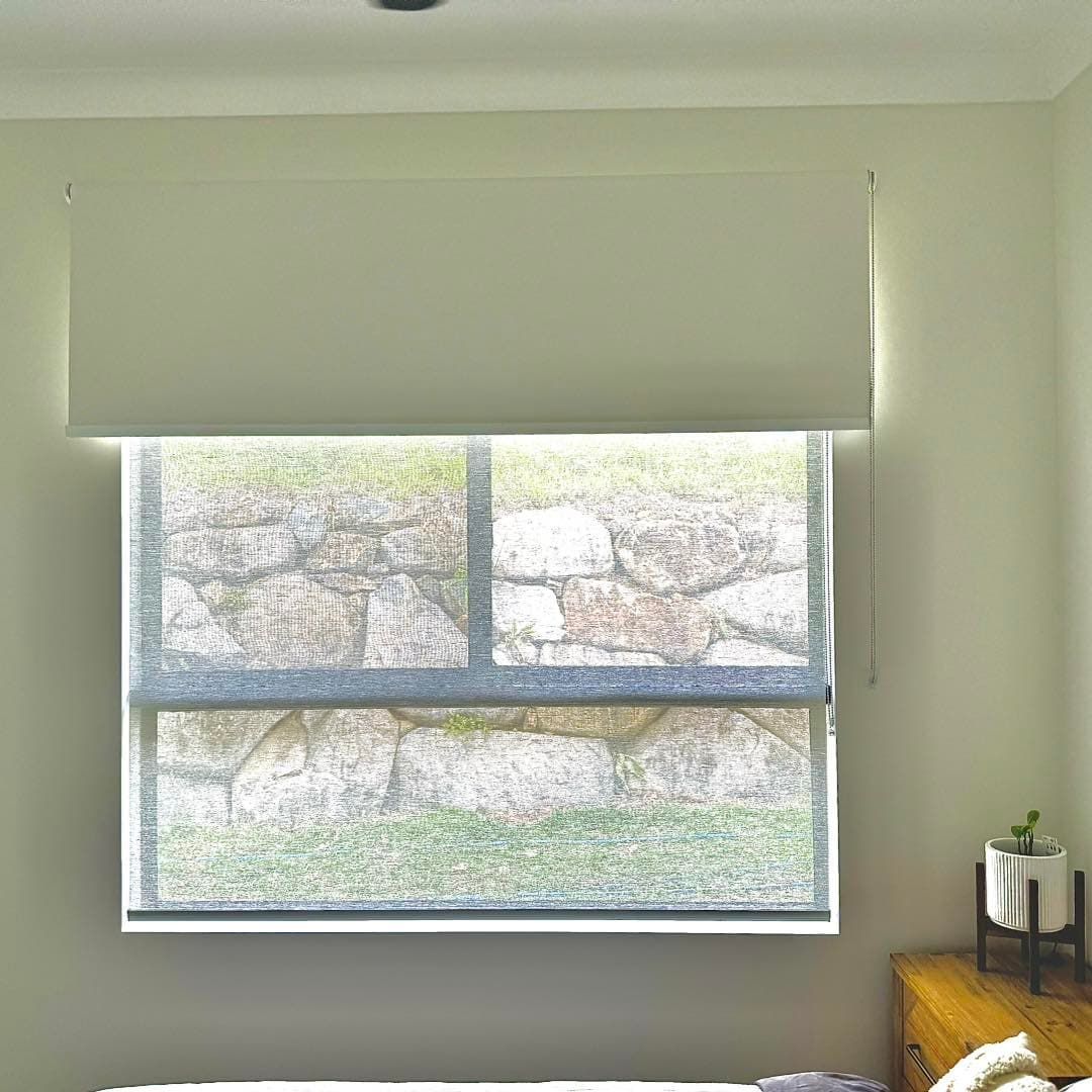 A Bedroom With a Large Window and a Ceiling Fan — Whitsunday Vogue Interiors in Cannonvale, QLD