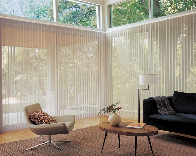Living Room With Large Windows, Vertical Blinds, a Chair, a Sofa, and a Coffee Table — Whitsunday Vogue Interiors in Cannonvale, QLD