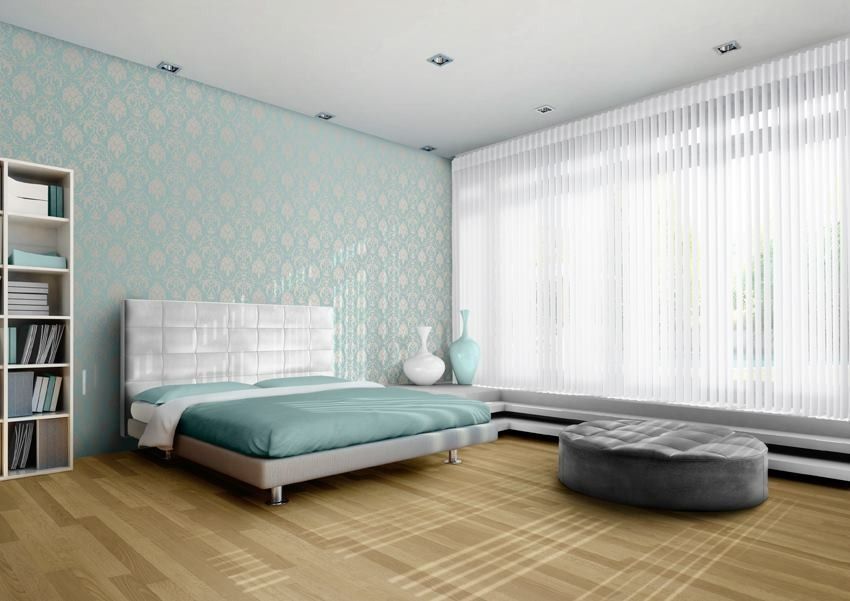 Living room with light-colored roman shades over large windows — Whitsunday Vogue Interiors in Cannonvale, QLD