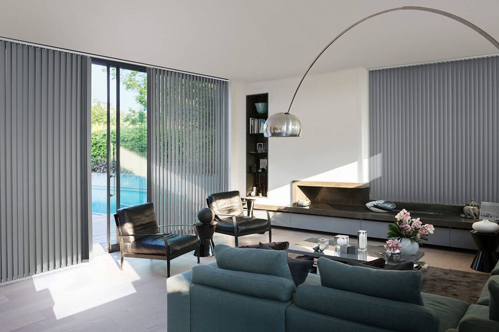 A Living Room With a Couch, Chairs, and a Lamp — Whitsunday Vogue Interiors in Hamilton Island, QLD