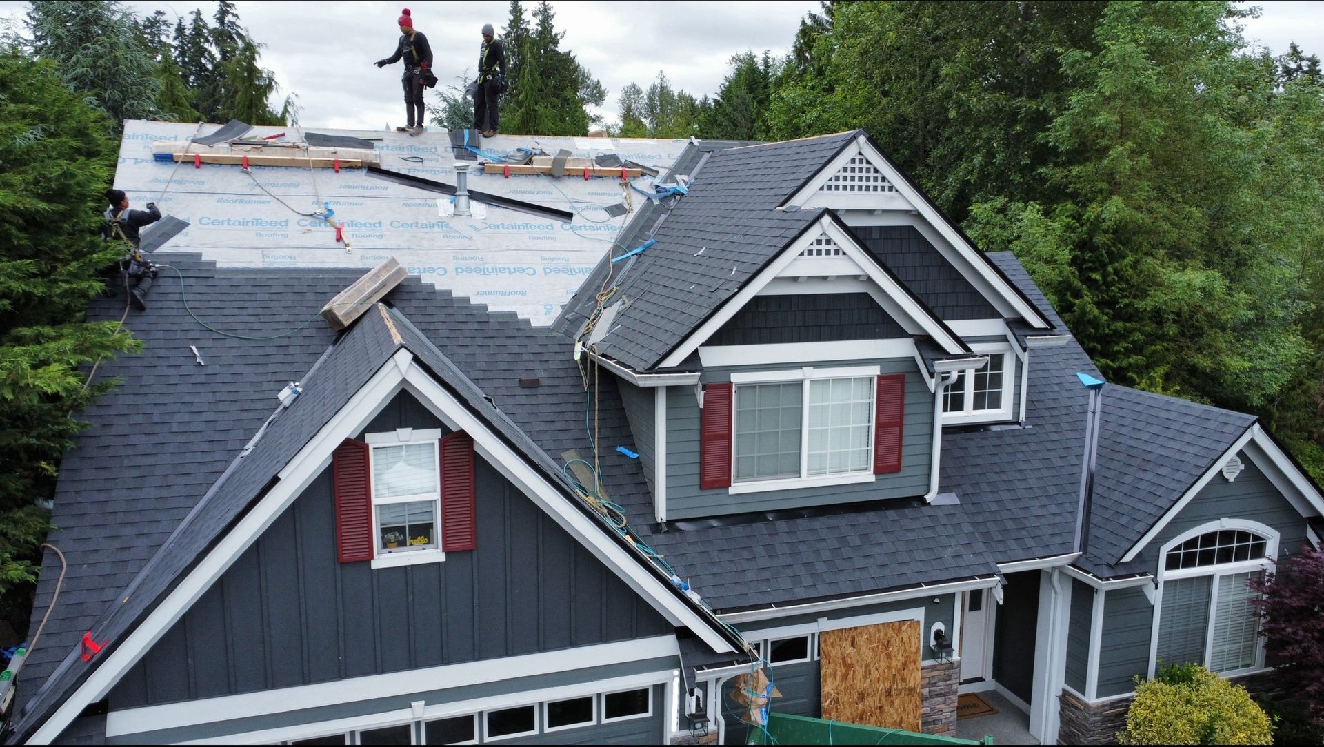 A large white roof with a blue sky in the background.
