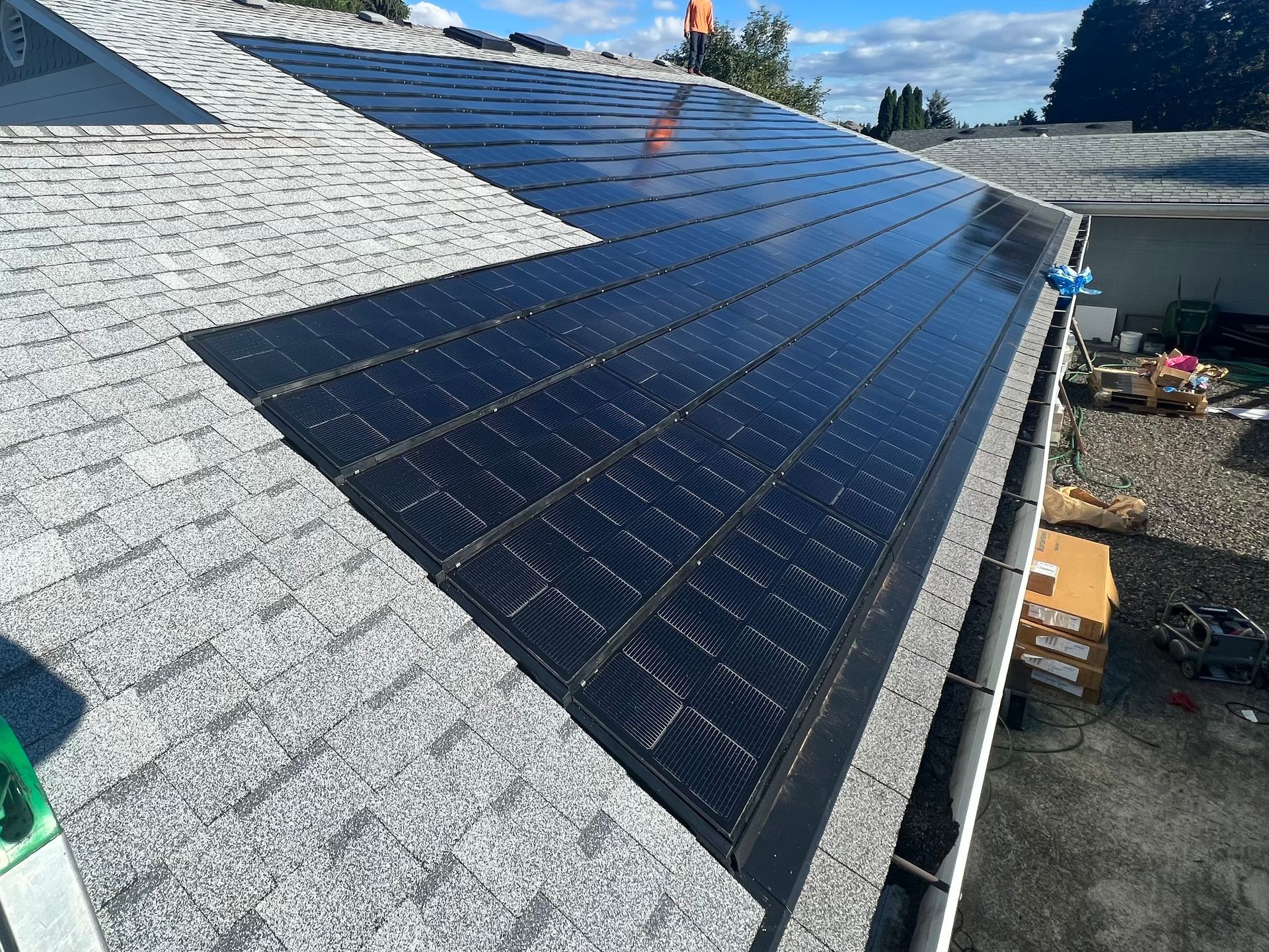 A roof with a lot of solar panels on it
