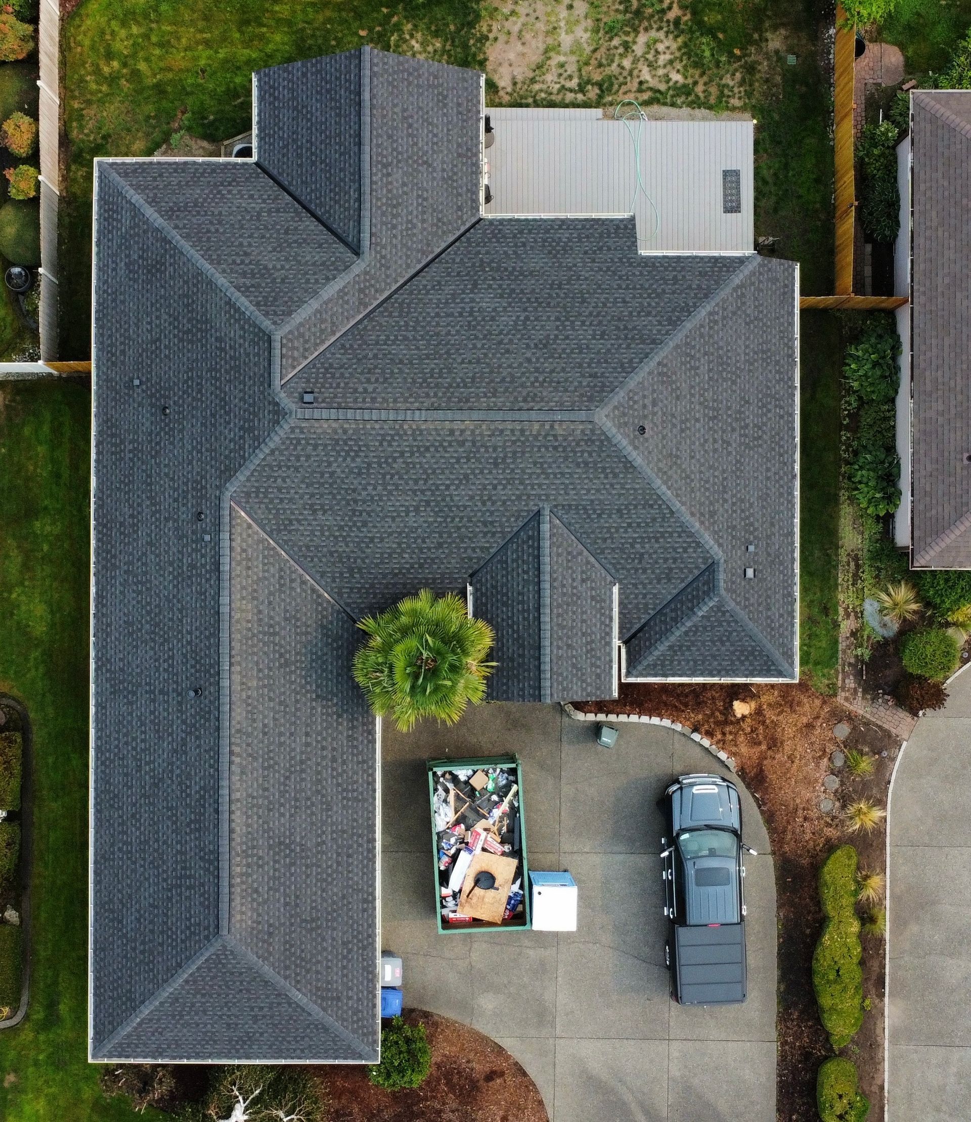 An aerial view of a house with a truck parked in front of it.