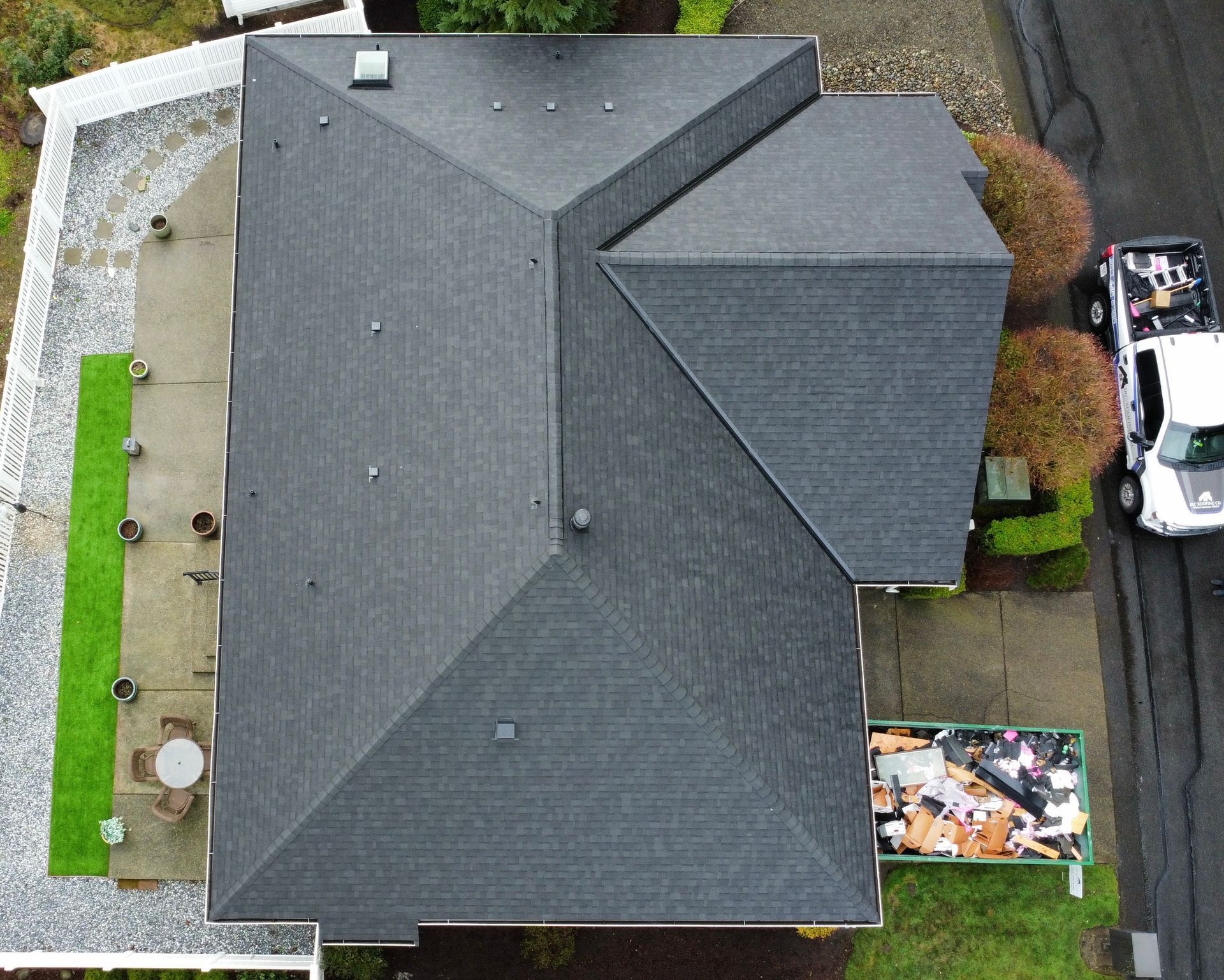 An aerial view of a house with a truck parked in front of it.