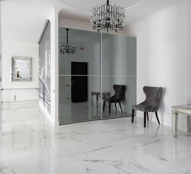 open room with white marble tile floors