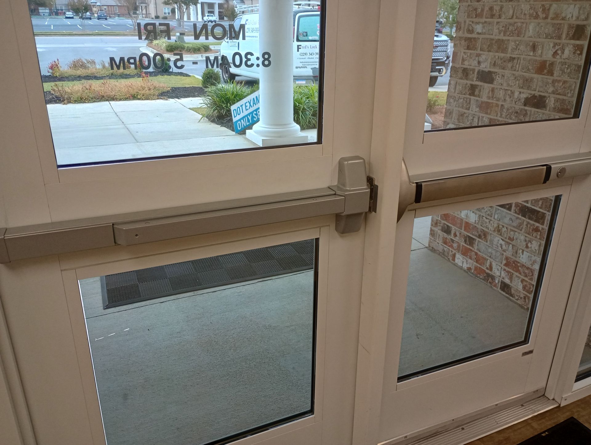 A close up of a door with a bar on it