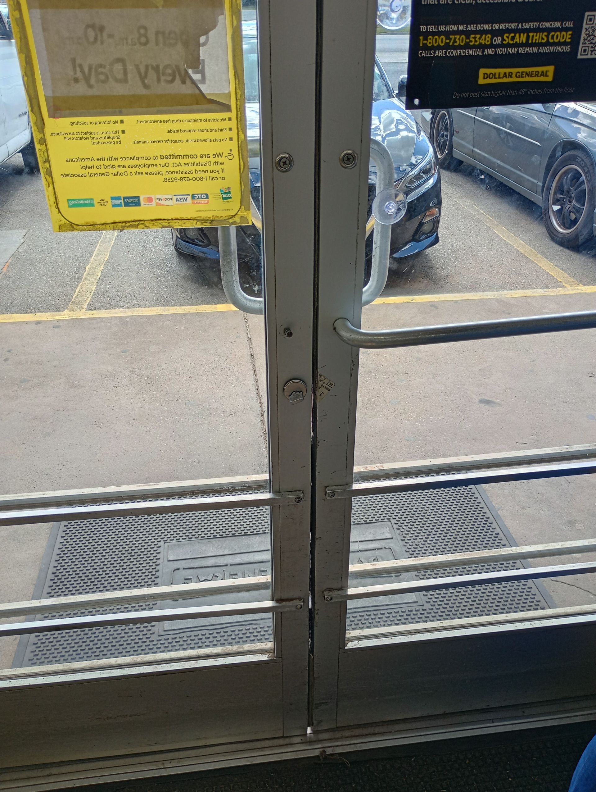 A close up of a door with a sign on it.