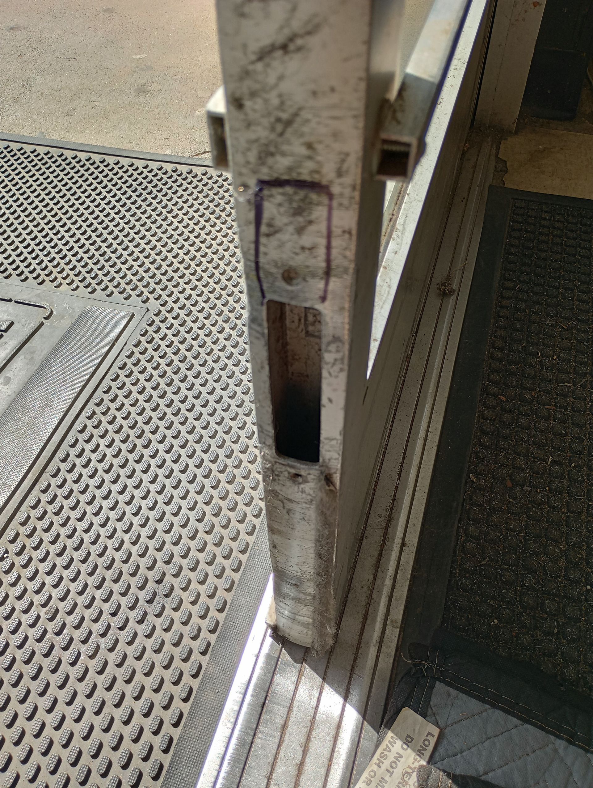 A close up of a door with a hole in it.