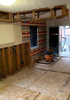 There is a vacuum cleaner in the middle of the room.